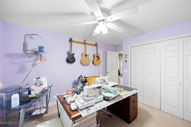 office featuring ceiling fan and light colored carpet