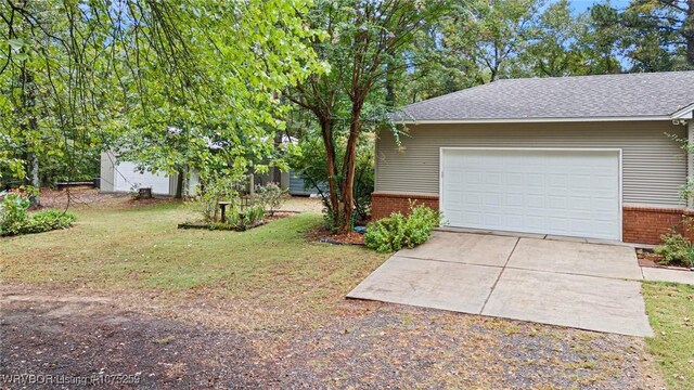 garage with a lawn