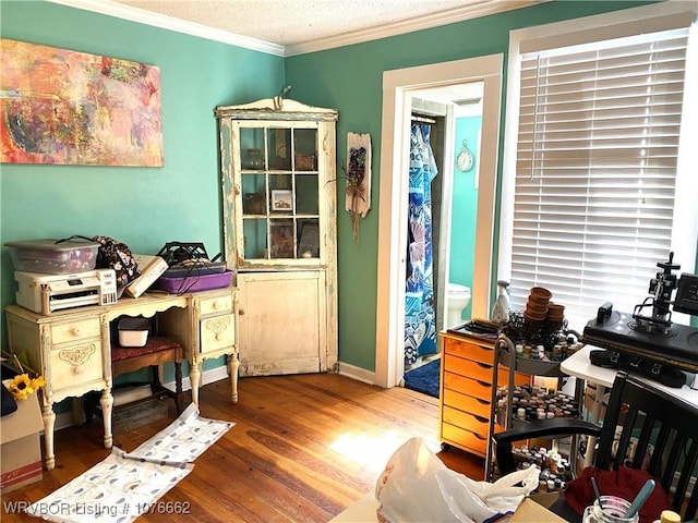 office area featuring crown molding, a textured ceiling, and hardwood / wood-style flooring