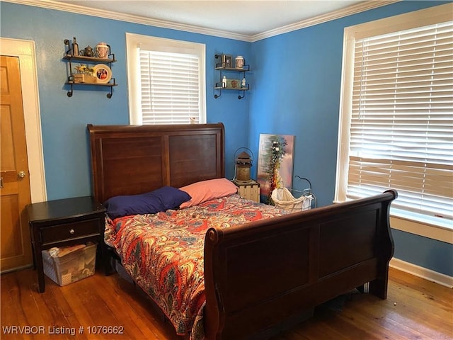 bedroom with crown molding and wood-type flooring