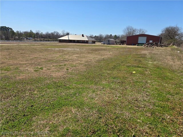 650 Paw Paw Rd, Roland, OK 74954 - view of yard with an outbuilding, a detached garage, and an outdoor structure