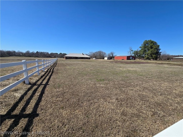650 Paw Paw Rd, Roland, OK 74954 - view of yard featuring an outbuilding, fence, and a rural view