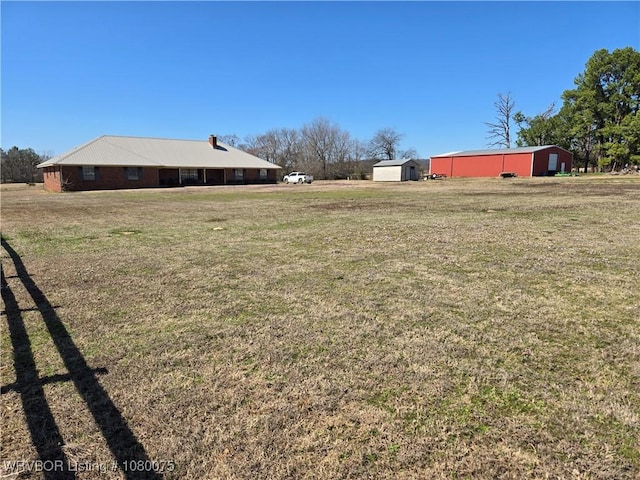 650 Paw Paw Rd, Roland, OK 74954 - view of yard featuring an outdoor structure and an outbuilding