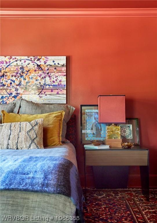 bedroom with ornamental molding