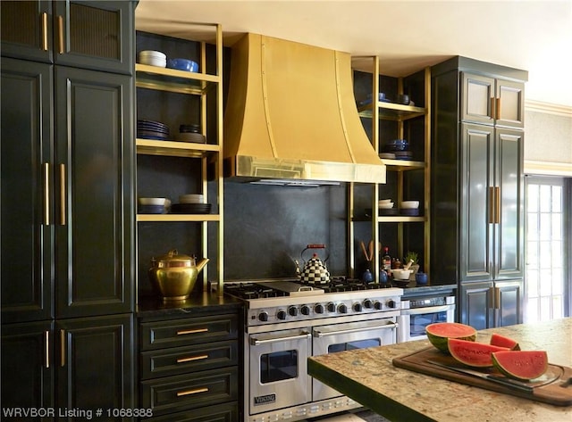 kitchen featuring light stone countertops, ornamental molding, custom range hood, and high end appliances