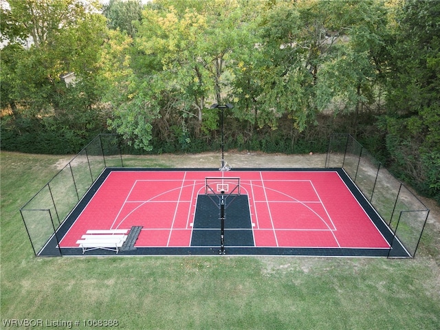 view of basketball court featuring a yard