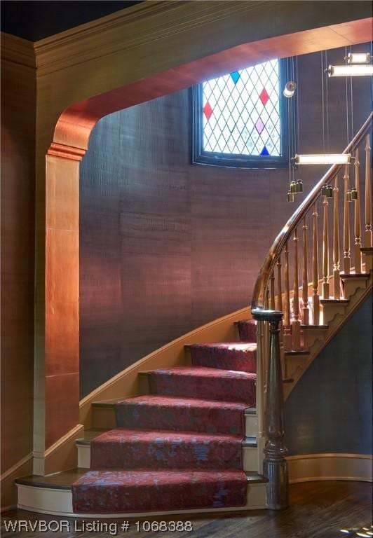 stairs featuring hardwood / wood-style flooring