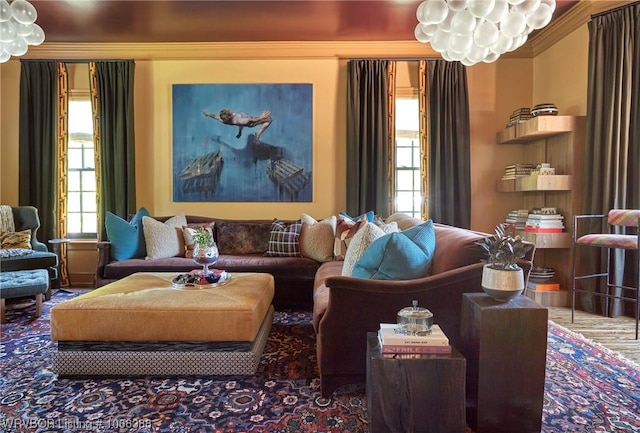 sitting room featuring crown molding, plenty of natural light, and hardwood / wood-style floors