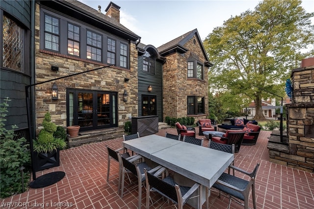 view of patio featuring outdoor lounge area and french doors