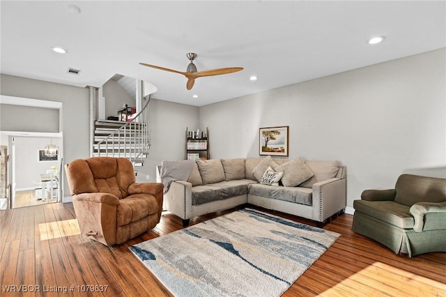 living area with hardwood / wood-style floors, recessed lighting, visible vents, and ceiling fan