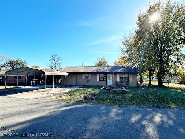 ranch-style house with a front lawn and a carport