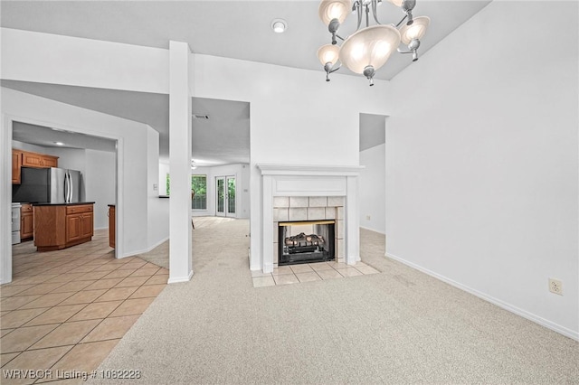 1121 Bourland St, Arkoma, OK 74901 - unfurnished living room with light carpet, a chandelier, a tile fireplace, and recessed lighting