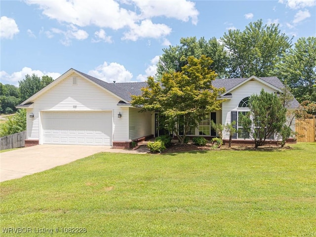 1121 Bourland St, Arkoma, OK 74901 - view of front of home featuring concrete driveway, a garage, and roof with shingles