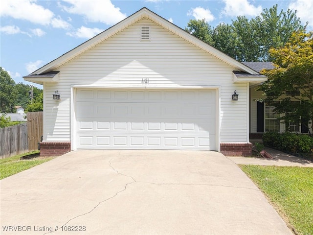 1121 Bourland St, Arkoma, OK 74901 - view of front facade with a garage