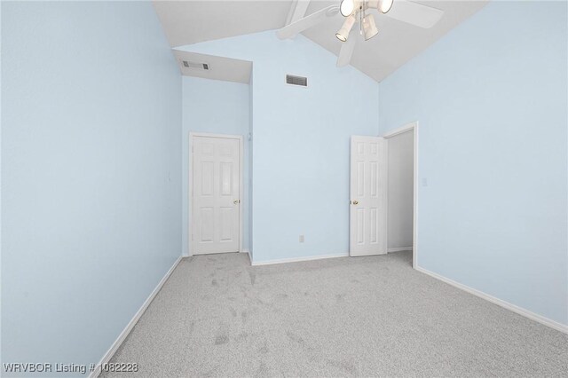 1121 Bourland St, Arkoma, OK 74901 - spare room with high vaulted ceiling, ceiling fan, beam ceiling, and light carpet