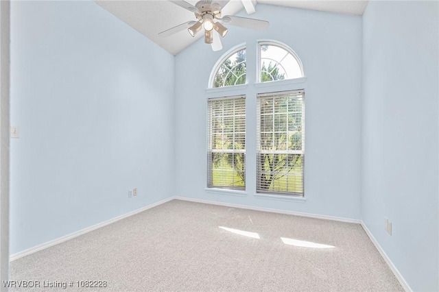 1121 Bourland St, Arkoma, OK 74901 - carpeted empty room featuring vaulted ceiling and a ceiling fan