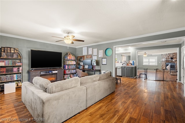 8005 Holly Ave, Fort Smith, AR 72908 - living room with a glass covered fireplace, crown molding, a ceiling fan, and wood finished floors