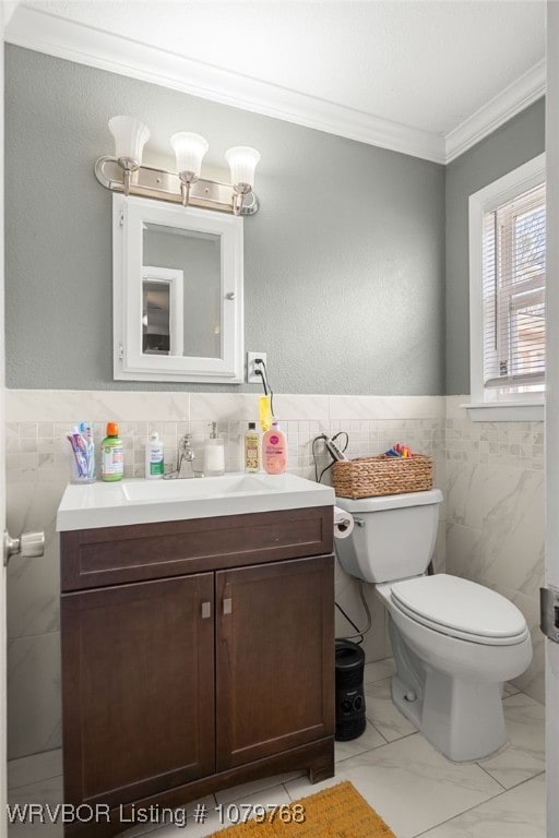 8005 Holly Ave, Fort Smith, AR 72908 - half bathroom featuring crown molding, toilet, vanity, marble finish floor, and tile walls