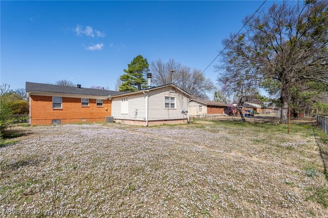 8005 Holly Ave, Fort Smith, AR 72908 - rear view of property featuring central air condition unit, fence, and crawl space