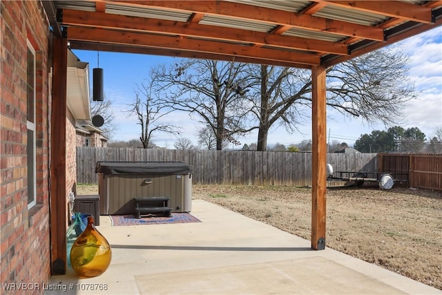 view of patio / terrace with a hot tub