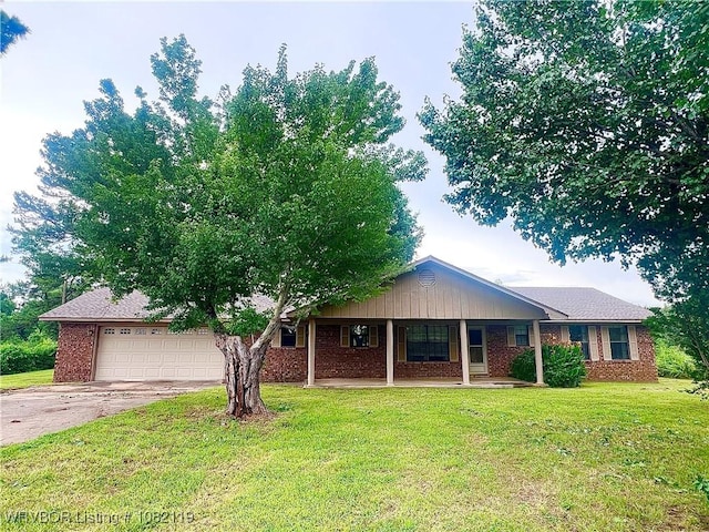 113749 4758th Rd, Muldrow, OK 74948 - single story home with driveway, a front lawn, brick siding, a porch, and a garage