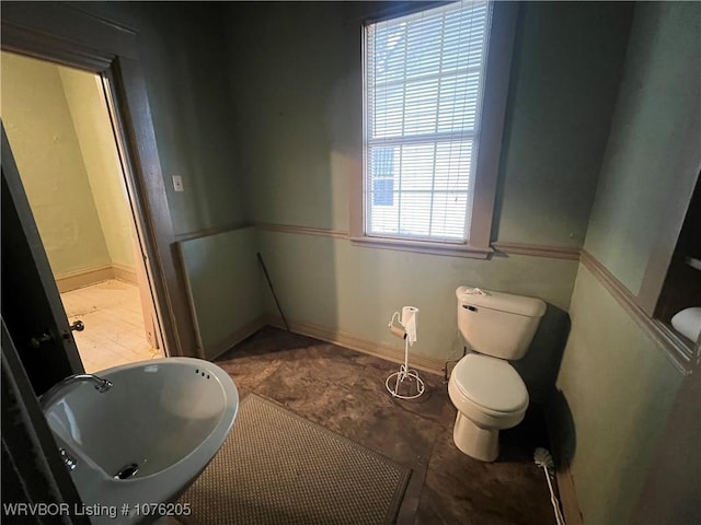 bathroom featuring plenty of natural light and sink