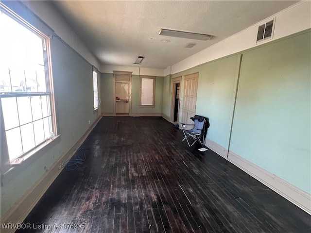 interior space with dark hardwood / wood-style flooring