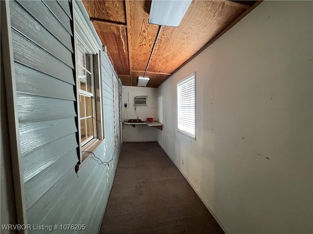 view of property exterior with an AC wall unit