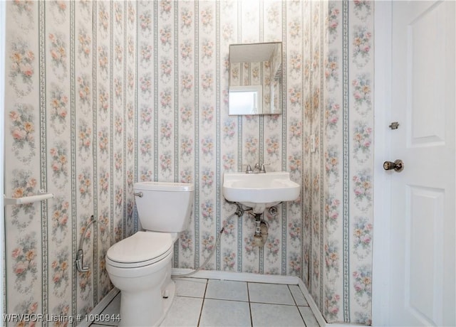 903 O St, Barling, AR 72923 - half bath featuring tile patterned floors, baseboards, toilet, and a sink