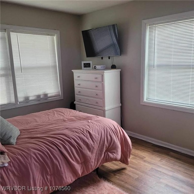 bedroom with light wood-type flooring