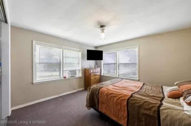 bedroom featuring dark colored carpet