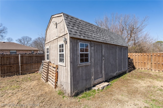 view of shed with a fenced backyard