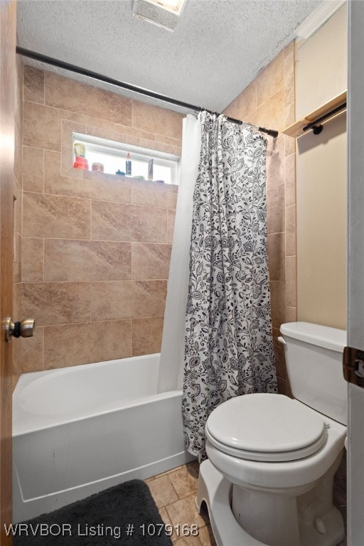 full bath with shower / tub combo, visible vents, a textured ceiling, and toilet