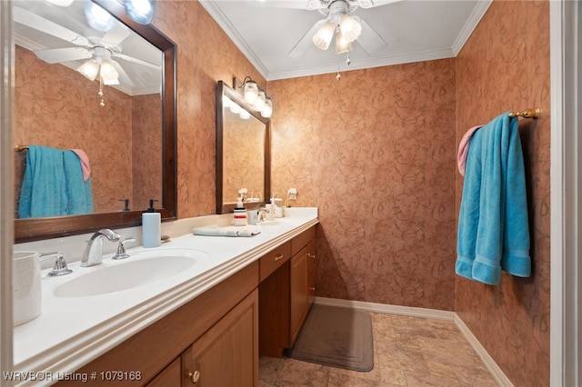 bathroom featuring a sink, a ceiling fan, baseboards, wallpapered walls, and crown molding