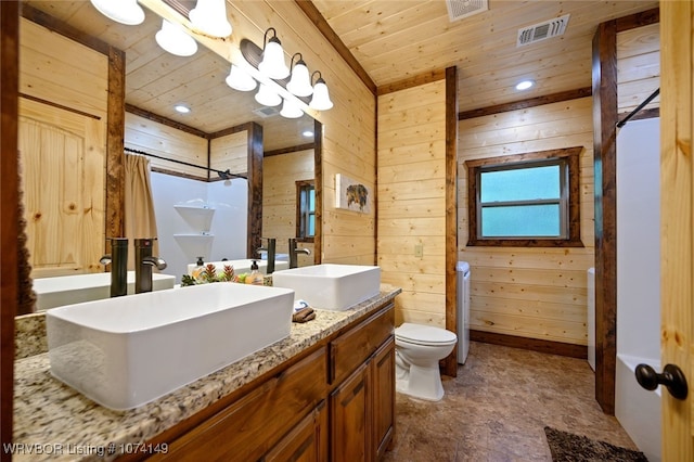 bathroom with vanity, curtained shower, wooden ceiling, and wood walls