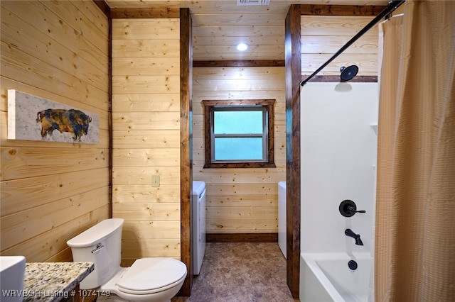 full bathroom featuring shower / tub combo with curtain, wooden walls, and washing machine and clothes dryer