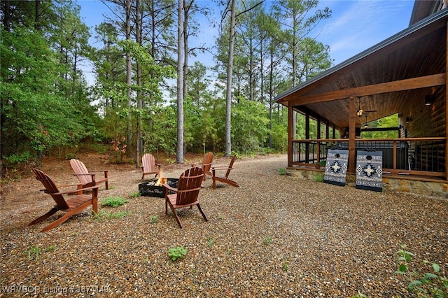 view of yard with an outdoor fire pit