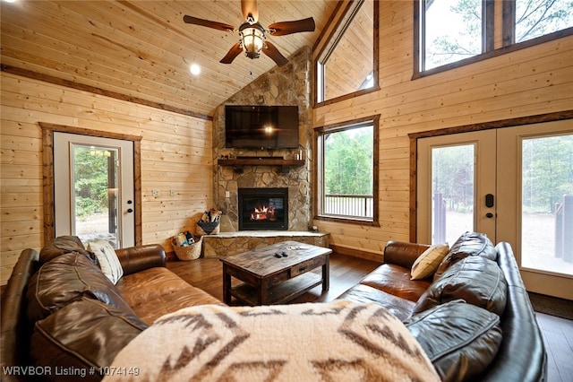 living room with wood walls, high vaulted ceiling, wooden ceiling, and hardwood / wood-style flooring