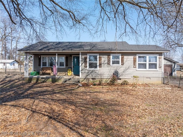 ranch-style house with crawl space, covered porch, fence, and roof with shingles