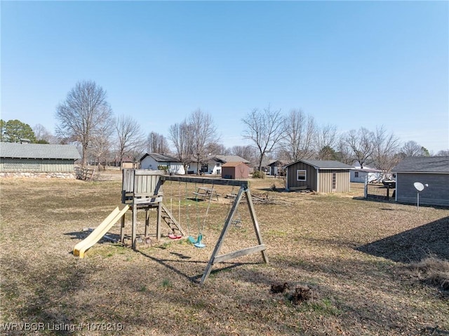 view of yard with an outbuilding and a playground