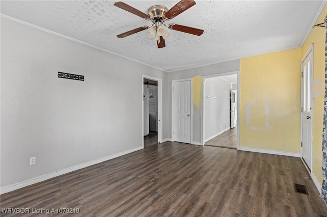 unfurnished bedroom featuring a textured ceiling, dark wood-type flooring, and ornamental molding