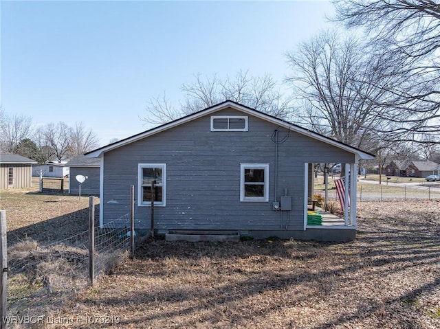 view of side of property with fence