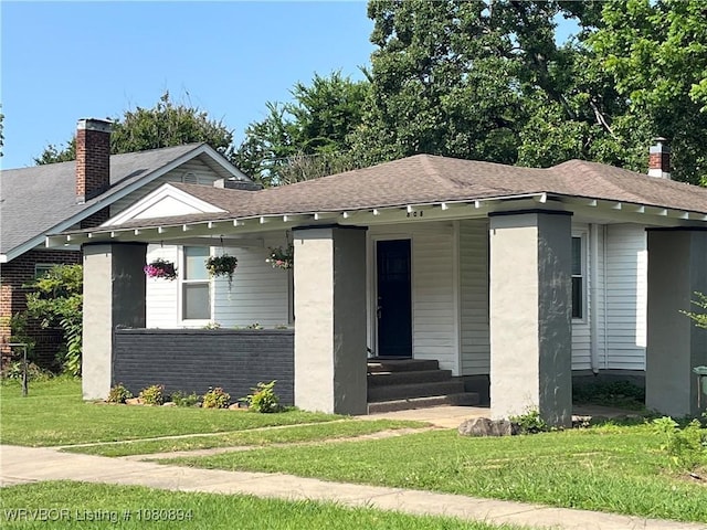 808 S 23rd St, Fort Smith, AR 72901 - bungalow with a front lawn, a porch, a chimney, roof with shingles, and brick siding