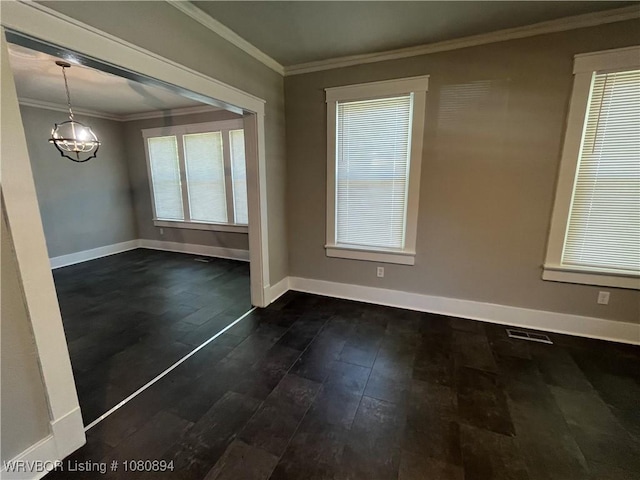 808 S 23rd St, Fort Smith, AR 72901 - unfurnished room featuring dark wood finished floors, ornamental molding, baseboards, plenty of natural light, and a chandelier