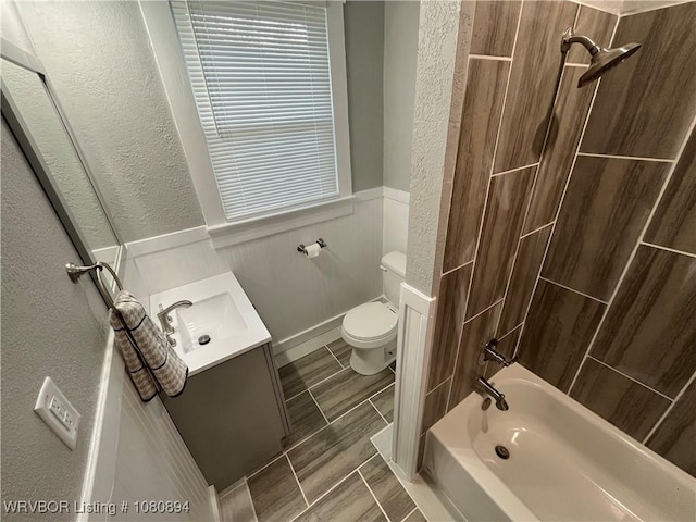 808 S 23rd St, Fort Smith, AR 72901 - full bathroom with a textured wall, vanity, toilet, wainscoting, and tub / shower combination