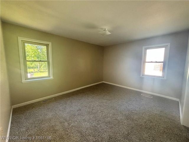 1117 W Creek Ave, Sallisaw, OK 74955 - carpeted spare room with baseboards