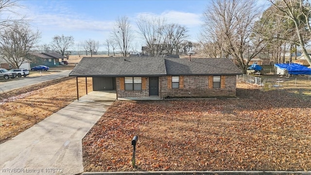 view of front of home with a carport