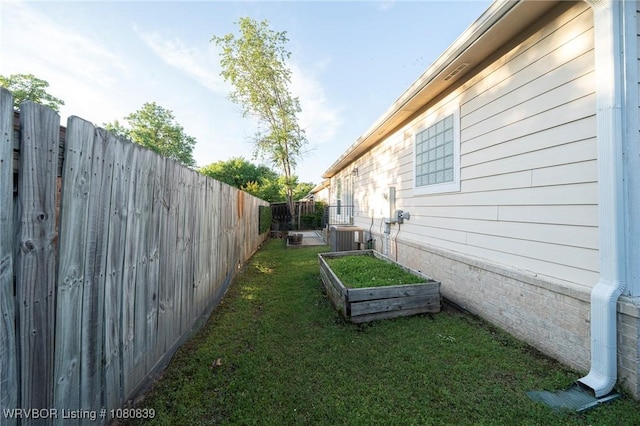 2808 May Branch Pt, Fort Smith, AR 72903 - view of yard with a fenced backyard, central air condition unit, and a garden