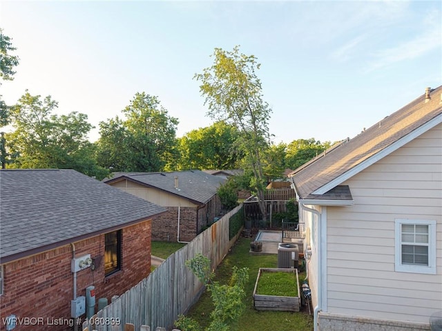 2808 May Branch Pt, Fort Smith, AR 72903 - view of home's exterior with fence, a shingled roof, and cooling unit
