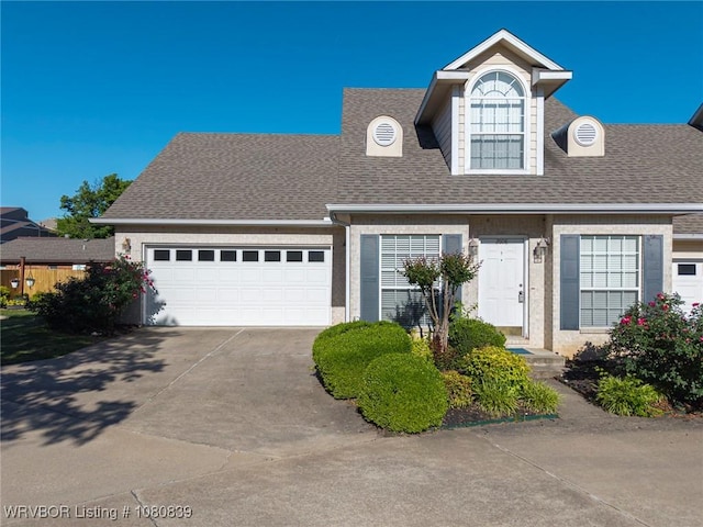 2808 May Branch Pt, Fort Smith, AR 72903 - view of front of house with driveway, a shingled roof, and a garage